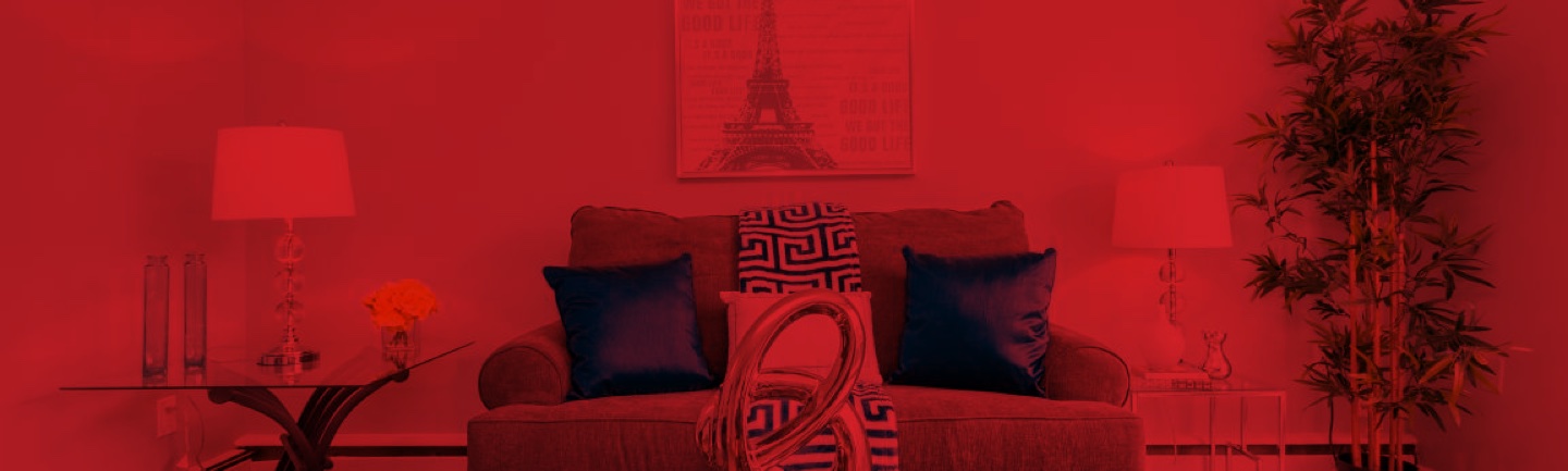 interior living room with a sofa, lamps and a picture of the ieffel tower all multiplied by red